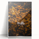 Art deco poster of a stylized fall landscape in muted orange and brown tones, framed in white acrylic.
