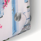 Large abstract wall art in vibrant orange and blue tones on acrylic glass, perfect for modern dining room decor.