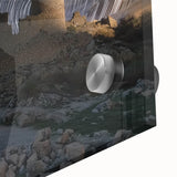 Close-up of an acrylic landscape print showcasing a majestic castle surrounded by vibrant greenery and a clear blue sky, perfect for home decor.