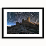 Black-framed landscape artwork showcasing a majestic castle surrounded by lush greenery and a serene sky, elegantly matted for a sophisticated display.