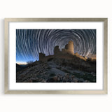 Elegant silver-framed landscape artwork showcasing a picturesque castle scene, complete with a mat border, perfect for enhancing home decor with a touch of sophistication.