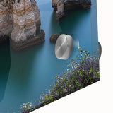 A close-up view of a stunning acrylic glass artwork depicting colorful landscapes and dramatic cliffs, showcasing intricate details and vibrant hues that enhance any decor.