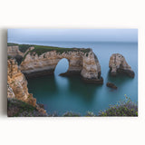 Stretched canvas artwork showcasing a stunning landscape of rugged cliffs under a vibrant sunset, ideal for home decor, evoking a sense of adventure and tranquility.