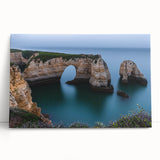 Stretched canvas artwork depicting a serene landscape of dramatic cliffs under a vibrant sunset, ideal for home decor and enhancing interior spaces.
