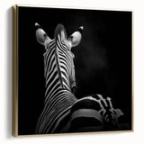 Framed canvas artwork showcasing a vibrant design of various animals in silver and gold hues, elegantly displayed against a white background, perfect for enhancing home decor.