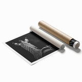Rolled canvas print showcasing a vibrant animal-themed design, featuring intricate details and colorful illustrations, securely packaged in a protective cardboard tube for shipping.