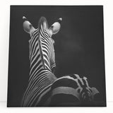 Stretched canvas artwork depicting a vibrant animal design, featuring colorful illustrations of various wildlife, perfect for enhancing home decor and adding a lively touch to any room.