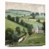 Landscape wall art featuring a serene countryside view, displayed in a sleek acrylic glass frame with mounting pins, adding a modern touch to any decor.