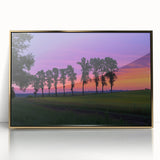 Framed acrylic landscape artwork depicting a serene countryside scene with vibrant green fields and a blue sky, elegantly bordered in gold for a sophisticated touch.