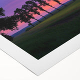 Rolled canvas artwork showcasing a serene countryside landscape with lush green fields and rolling hills, elegantly packaged in a protective cardboard tube for safe transport.