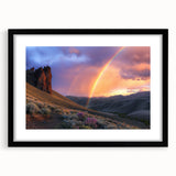 Black-framed landscape artwork depicting a serene desert scene with a mat, showcasing warm tones of orange and beige, perfect for home decor enhancement.