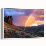 Framed canvas artwork showcasing a vibrant desert landscape with warm tones of orange and brown, elegantly displayed against a white background, ideal for home decor.