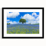 Black wooden frame with a white mat showcasing a vibrant landscape artwork, featuring rolling green fields and a clear blue sky, perfect for modern home decor.