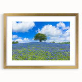Elegant gold-framed landscape artwork featuring vibrant green fields and a serene sky, designed with a decorative mat for an upscale home decor touch.