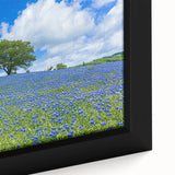 Vibrant close-up of a framed canvas showcasing a serene landscape with lush green fields and a clear blue sky, ideal for home decor or office settings.