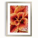 Textured art print of abstract florals in muted earth tones, framed in silver, ideal for bedroom wall decor.