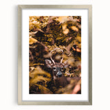 Textured abstract art print in warm autumnal hues on a silver-framed mat, suitable for bedroom decor.