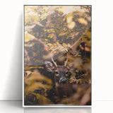 Art deco poster of abstract fall trees in warm orange and brown hues, acrylic print framed in white.
