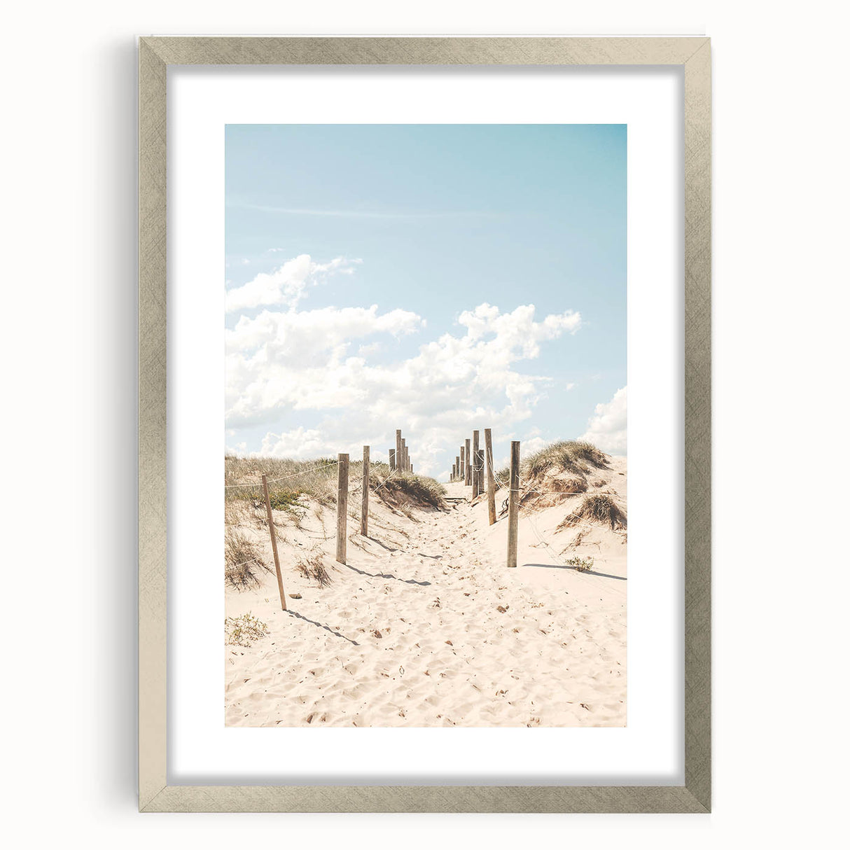 Abstract textured art print in warm orange and yellow tones, framed in silver, ideal for bedroom wall decor.