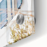 Large abstract wall art in vivid orange and blue tones on acrylic glass, ideal for dining room ambiance.