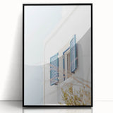 Large abstract wall art featuring swirling blue and white patterns on a black acrylic print.