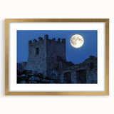 Elegant gold-framed landscape print showcasing a picturesque castle, surrounded by lush greenery and blue skies, perfect for enhancing home decor.