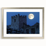 Silver-framed landscape artwork showcasing a picturesque castle scene, highlighted with a mat for added elegance, perfect for home decor or gallery display.