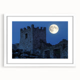 Elegant white-framed landscape artwork showcasing a majestic castle surrounded by lush greenery, perfect for home decor or office aesthetics. The mat enhances the sophisticated presentation.