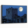 Framed canvas artwork showcasing a picturesque landscape with a majestic castle set against a serene sky. Features a sleek black frame, enhancing the elegant design for home decor.