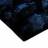 Close-up view of a stretched canvas artwork depicting a landscape with a majestic castle surrounded by vibrant greenery and a serene sky, perfect for home decor.