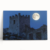 Stretched canvas artwork depicting a serene landscape with a majestic castle surrounded by lush greenery and vibrant blue skies, perfect for home decor.