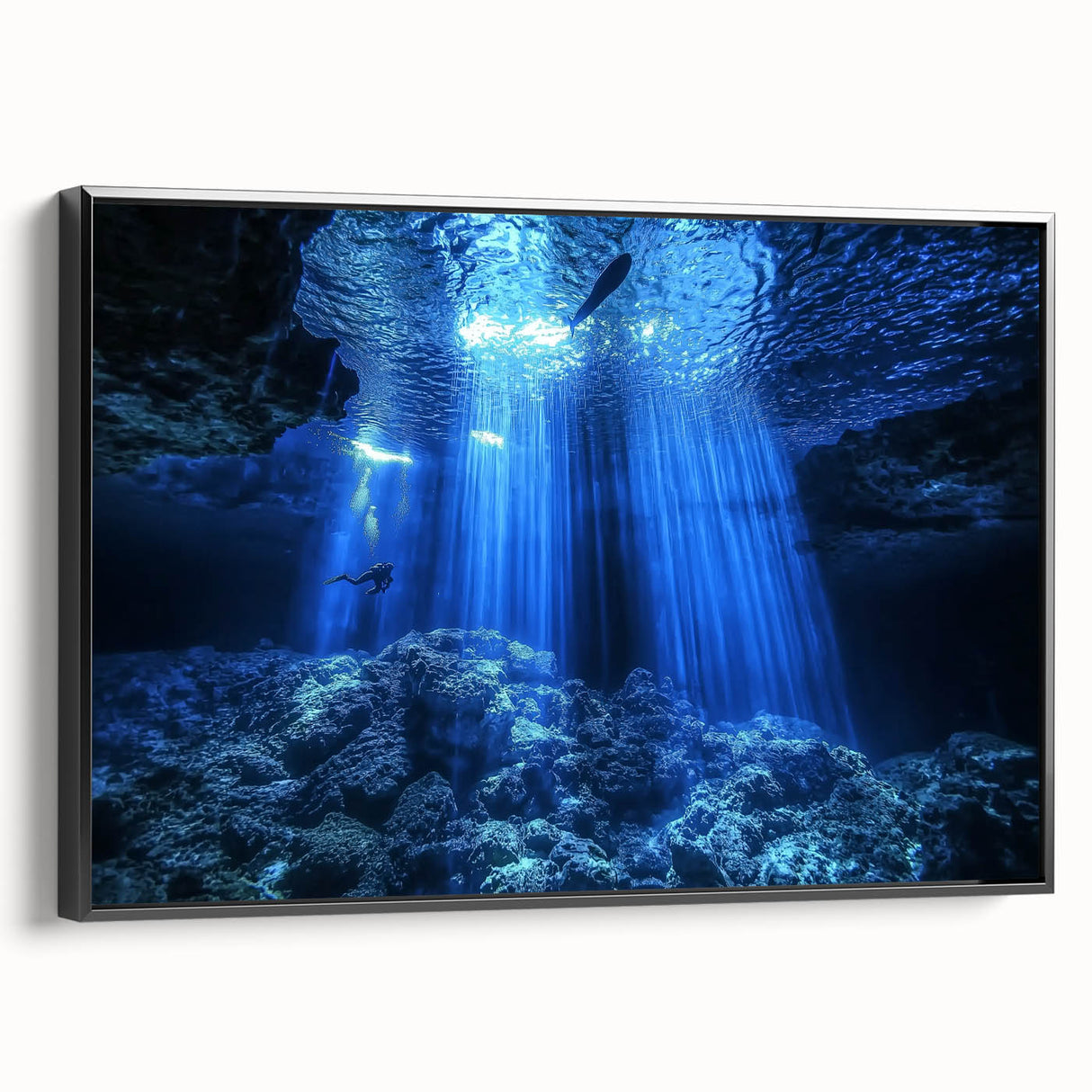 Framed canvas artwork depicting a serene landscape scene with caves, featuring a sleek black frame and smooth side view, perfect for modern home decor.
