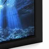 Close-up of a framed canvas depicting a stunning landscape scene with intricate cave details, showcasing vibrant colors and textures, ideal for home decor.