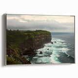 Framed canvas artwork showcasing a dramatic cliff landscape in muted colors, elegantly bordered in silver, ideal for enhancing modern home decor.