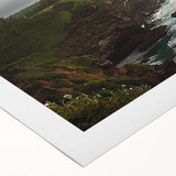 Vibrant rolled canvas artwork depicting dramatic cliffs and serene landscapes, showcasing rich colors and textures, perfect for home decor or art enthusiasts.