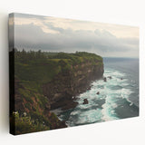 Stretched canvas artwork depicting a breathtaking view of rugged cliffs against a vibrant sunset, showcasing rich colors and intricate details, perfect for home decor.