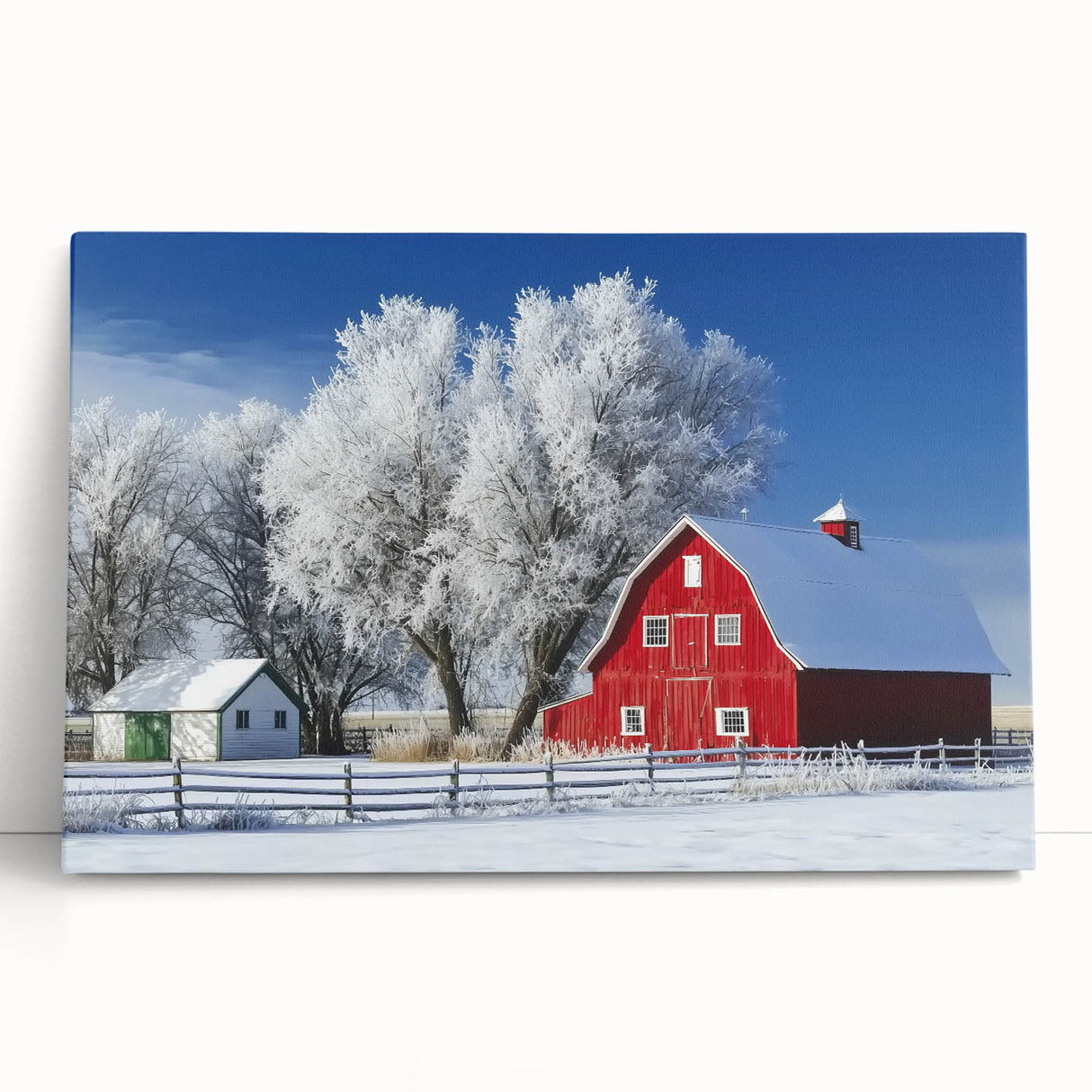 Stretched canvas artwork featuring a serene landscape scene with a rustic barn, leaning against a wall. Ideal for home decor, this piece adds a touch of countryside charm.