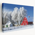 Landscape barn canvas artwork showcasing a rustic red barn surrounded by vibrant green fields and a clear blue sky, perfect for home decor. This stretched canvas adds a warm, countryside touch to any room.
