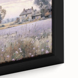 Close-up of a framed landscape wall art featuring a serene countryside scene with lush greenery and soft blue skies, perfect for home decor.
