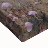 Close-up of a stretched canvas wall art depicting a serene countryside landscape with vibrant green fields, blue skies, and soft clouds, perfect for home decor.