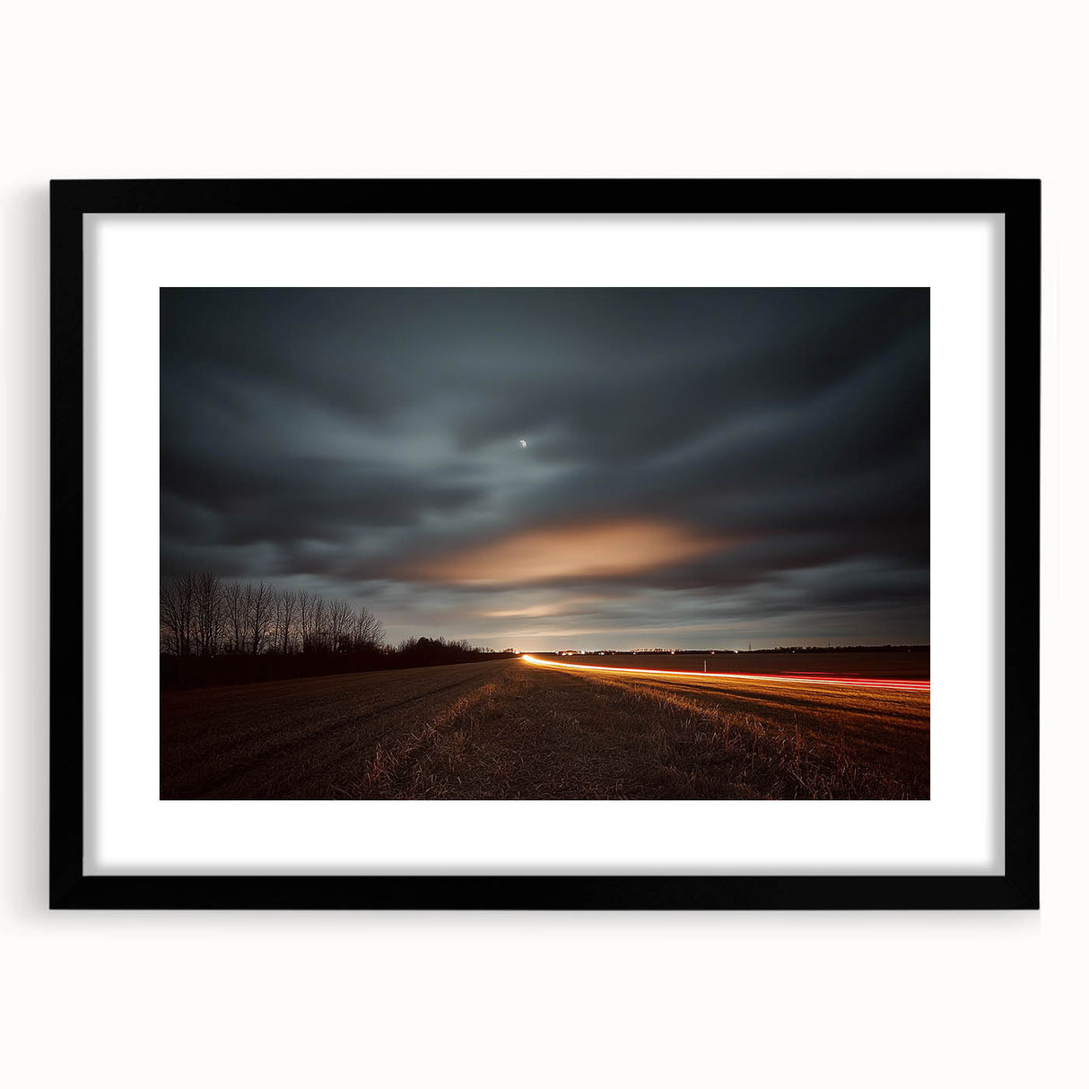 Black frame showcasing a countryside landscape print with a white mat, ideal for home decor. The framed artwork emphasizes serene rural scenery, perfect for enhancing interior aesthetics.