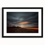 Black frame showcasing a countryside landscape print with a white mat, ideal for home decor. The framed artwork emphasizes serene rural scenery, perfect for enhancing interior aesthetics.