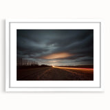 Framed countryside landscape art print showcasing vibrant green fields and a serene blue sky, elegantly mounted with a white mat, perfect for home decor.