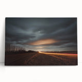 Stretched canvas art depicting a serene countryside landscape with rolling hills and vibrant greenery, leaning against a textured wall, perfect for home decor.