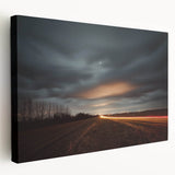 Vibrant stretched canvas artwork depicting a serene countryside landscape, showcasing lush green fields and a clear blue sky, ideal for home decor.