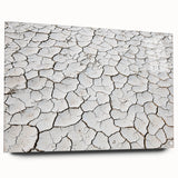 Acrylic glass artwork depicting a vibrant desert landscape with a side view, showcasing warm colors and intricate details, elegantly displayed with pins for mounting.