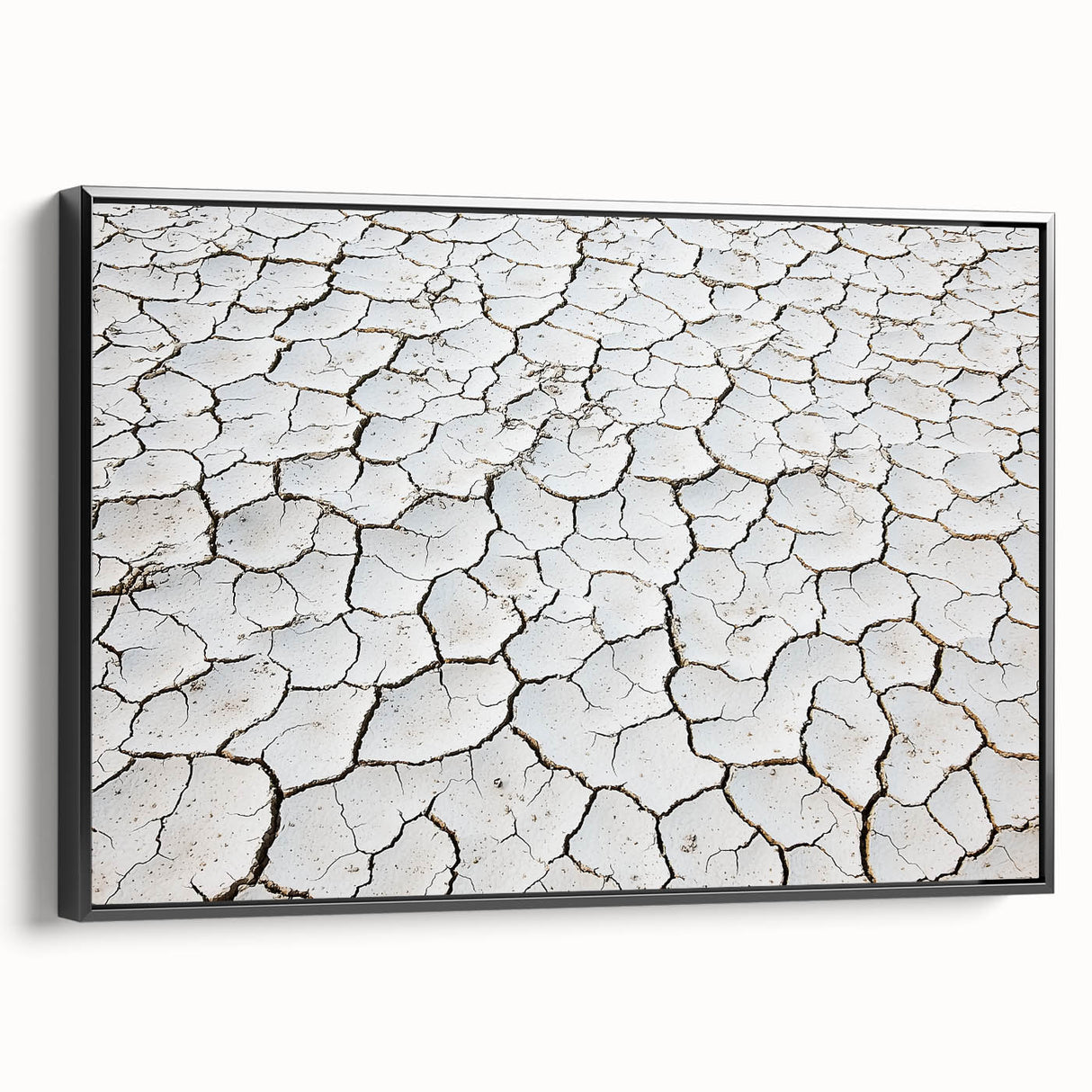Framed canvas artwork depicting a stunning desert landscape with warm hues of orange and yellow, showcased in a sleek black frame, perfect for modern home decor.
