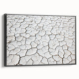 Framed canvas artwork depicting a stunning desert landscape with warm hues of orange and yellow, showcased in a sleek black frame, perfect for modern home decor.