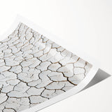 Desert landscape rolled canvas print showcasing vibrant hues of orange and yellow, capturing a serene sunset over arid dunes, perfect for home decor.