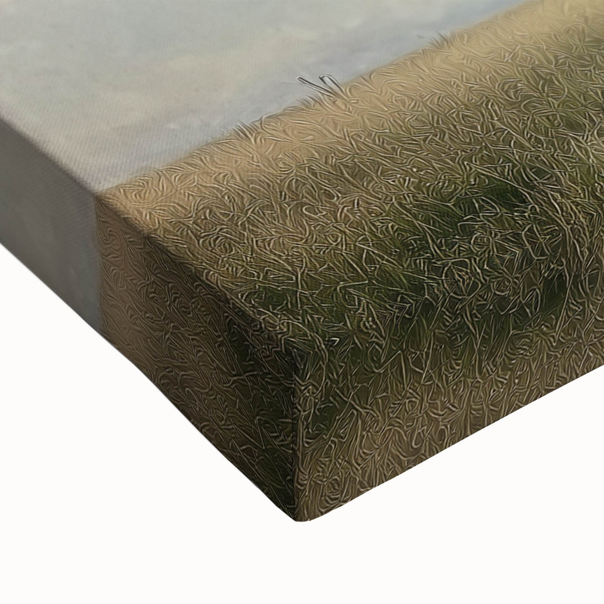 Close-up of a stretched canvas print depicting vibrant green fields under a clear blue sky, showcasing intricate details of the landscape and natural textures.